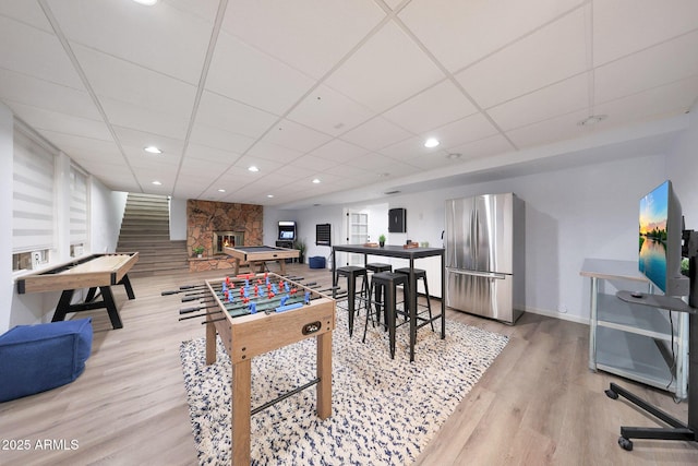 1444 E Myrna Ln, Tempe, AZ 85284 - playroom featuring a drop ceiling, light wood-type flooring, baseboards, recessed lighting, and a fireplace