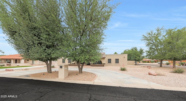 1444 E Myrna Ln, Tempe, AZ 85284 - view of front of property with stucco siding and curved driveway