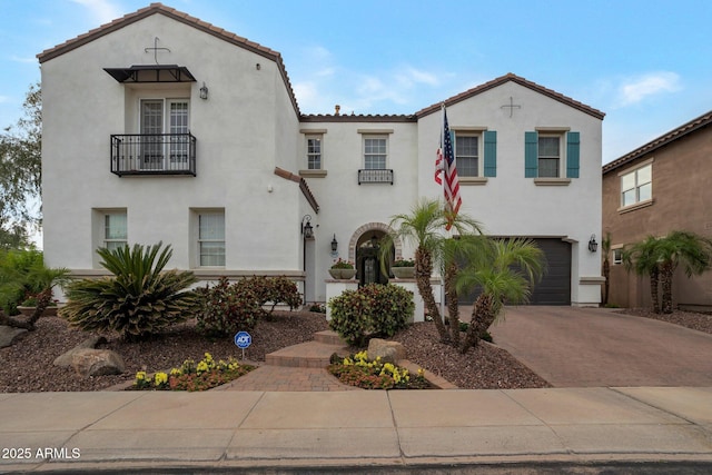 9608 N 184th Ln, Waddell, AZ 85355 - mediterranean / spanish-style house with driveway, stucco siding, a garage, and a tiled roof