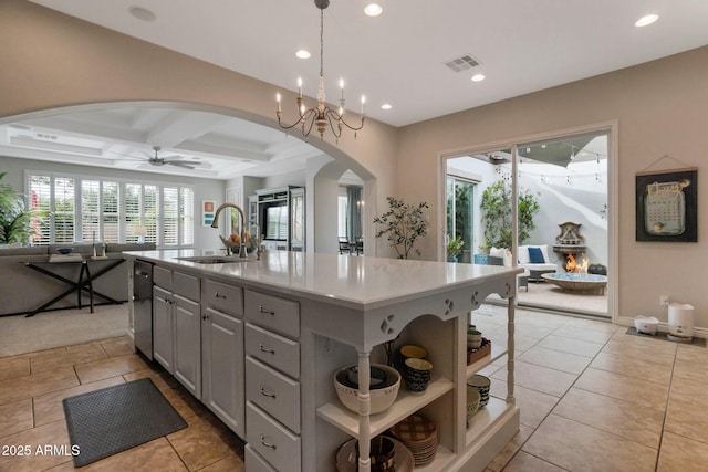 9608 N 184th Ln, Waddell, AZ 85355 - kitchen with a sink, arched walkways, gray cabinets, open floor plan, and coffered ceiling