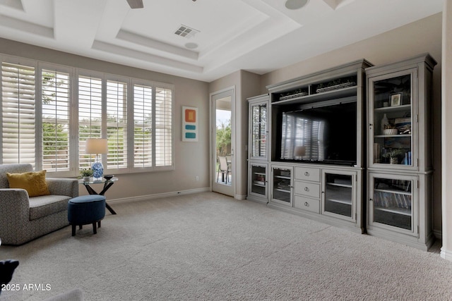 9608 N 184th Ln, Waddell, AZ 85355 - carpeted living area featuring a tray ceiling and baseboards