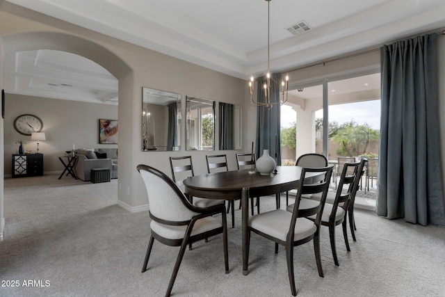 9608 N 184th Ln, Waddell, AZ 85355 - dining area featuring a chandelier, light carpet, and a raised ceiling