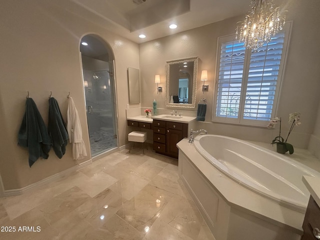 9608 N 184th Ln, Waddell, AZ 85355 - bathroom with a garden tub, a stall shower, vanity, a chandelier, and recessed lighting