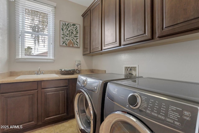 9608 N 184th Ln, Waddell, AZ 85355 - washroom featuring washer and clothes dryer, cabinet space, and light tile patterned flooring