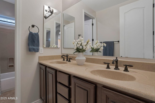 9608 N 184th Ln, Waddell, AZ 85355 - bathroom with double vanity and a tub to relax in