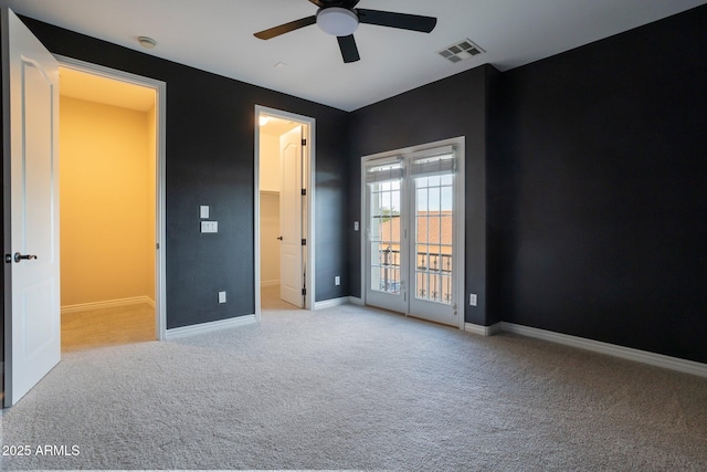9608 N 184th Ln, Waddell, AZ 85355 - unfurnished bedroom featuring carpet floors, a walk in closet, baseboards, and ceiling fan