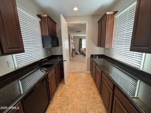 9608 N 184th Ln, Waddell, AZ 85355 - kitchen with a sink, dark stone counters, dark brown cabinets, recessed lighting, and light tile patterned flooring
