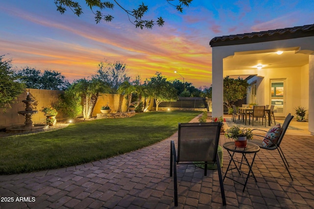 9608 N 184th Ln, Waddell, AZ 85355 - patio terrace at dusk with outdoor dining space