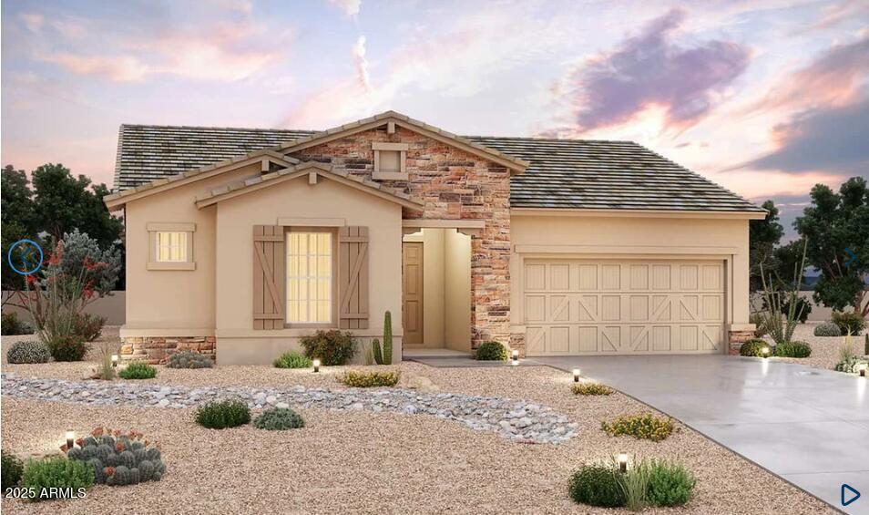 20075 W San Miguel Ave, Litchfield Park, AZ 85340 - view of front of house with stone siding, an attached garage, concrete driveway, and stucco siding