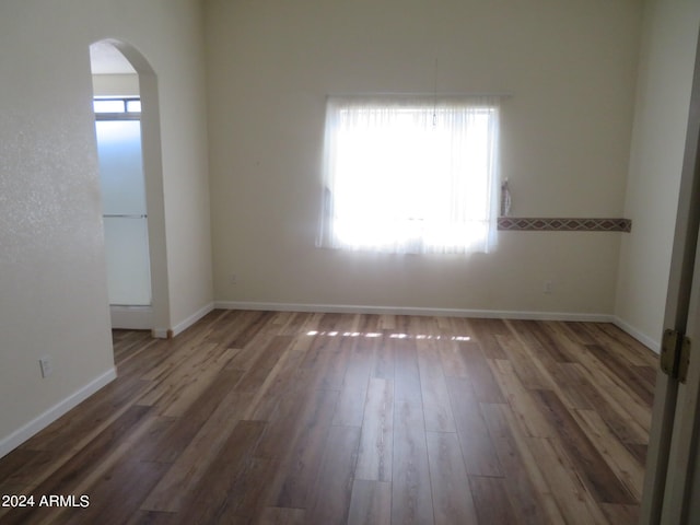 empty room featuring dark hardwood / wood-style floors