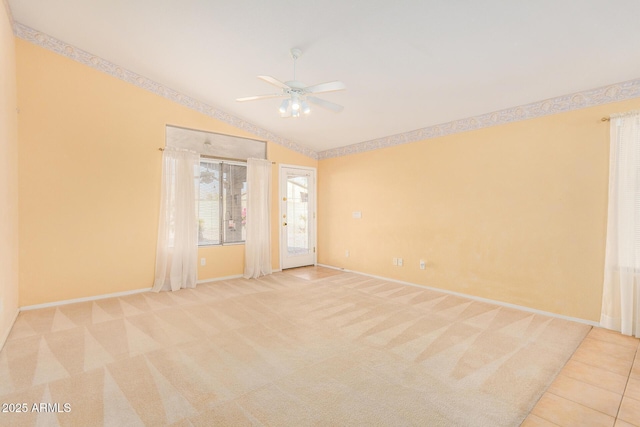 unfurnished room featuring light colored carpet, ceiling fan, and lofted ceiling