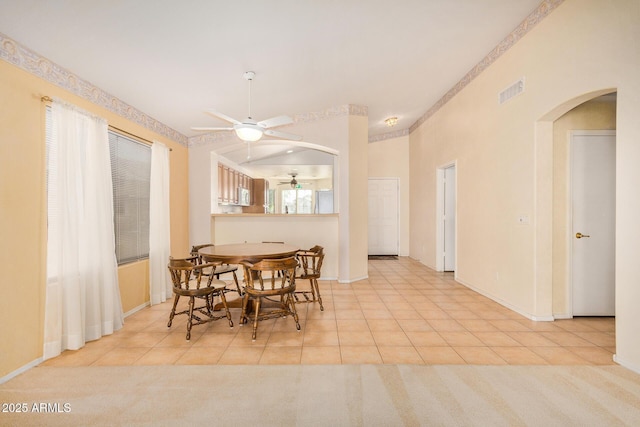 tiled dining room featuring ceiling fan