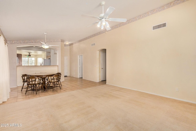 dining area with ceiling fan and light tile patterned floors