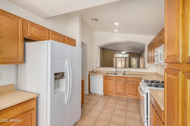 kitchen featuring ceiling fan, light tile patterned flooring, white appliances, and sink