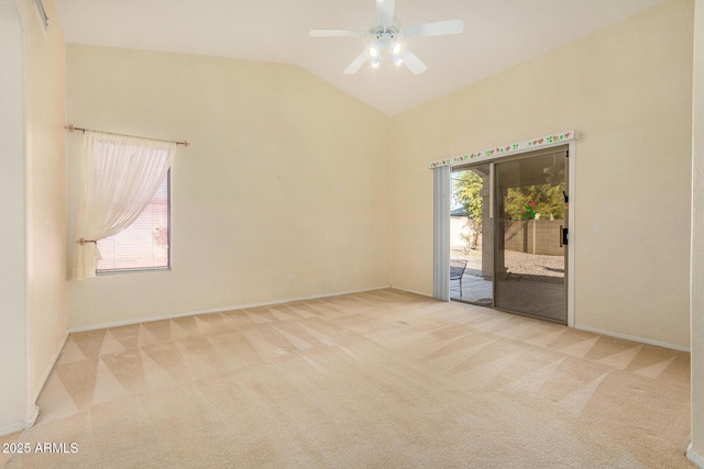 carpeted empty room featuring ceiling fan and lofted ceiling