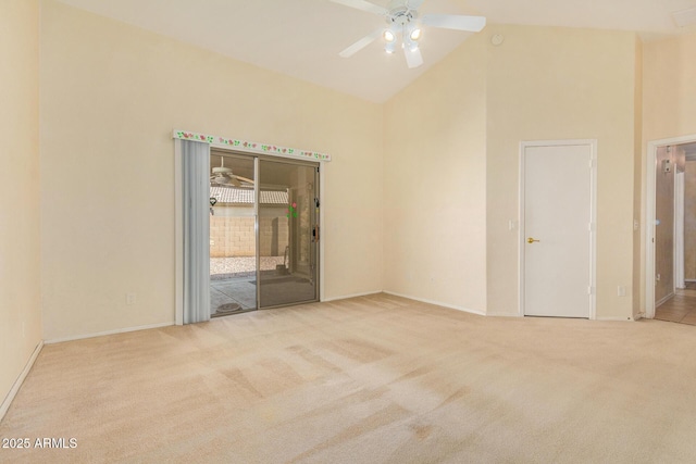 carpeted empty room featuring ceiling fan and high vaulted ceiling