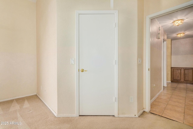 corridor featuring light carpet