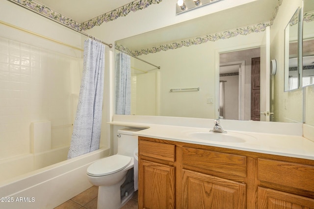 full bathroom with tile patterned floors, shower / bath combo with shower curtain, vanity, and toilet