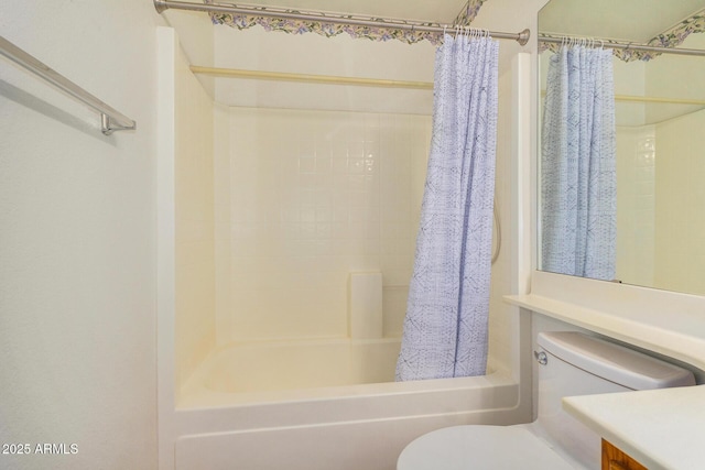 full bathroom with shower / bathtub combination with curtain, vanity, and toilet