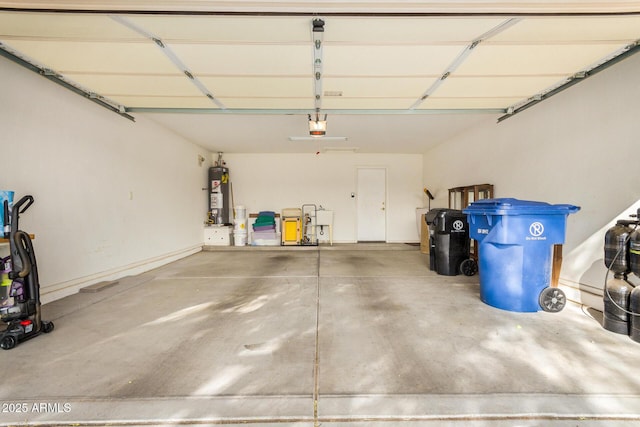 garage with a garage door opener and gas water heater