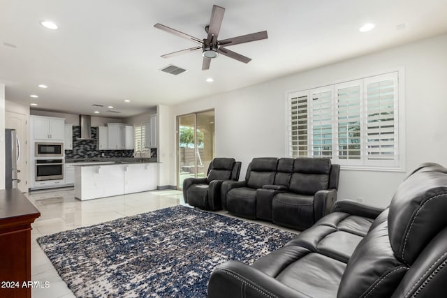 living room with ceiling fan