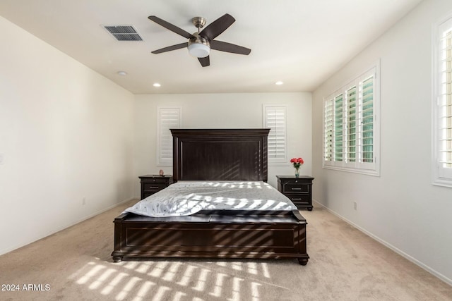 carpeted bedroom with ceiling fan