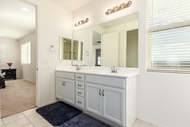 bathroom with tile patterned flooring and vanity