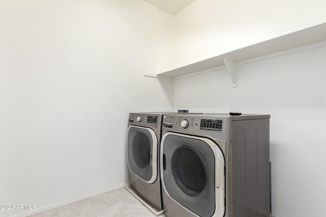 laundry room with washing machine and dryer