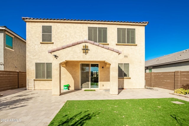 rear view of property with a patio