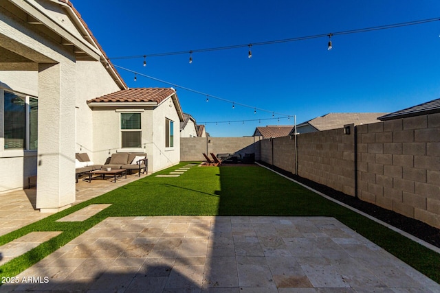 view of yard featuring an outdoor living space and a patio area