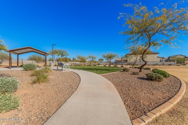 view of property's community featuring a lawn