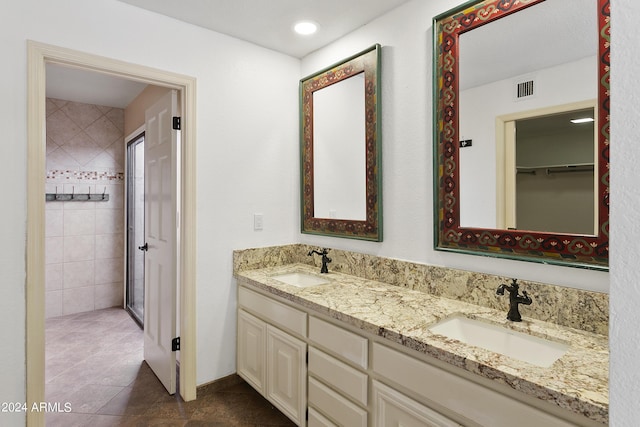 bathroom with vanity and tile patterned floors