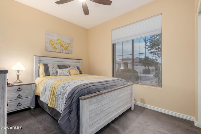 bedroom with dark carpet and ceiling fan