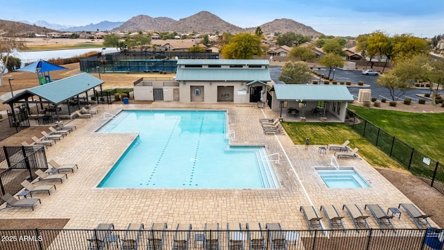 view of pool featuring a community hot tub, a mountain view, a gazebo, and a patio area