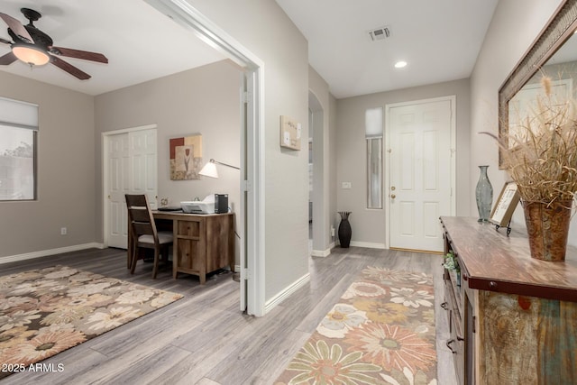 entrance foyer with light hardwood / wood-style flooring and ceiling fan