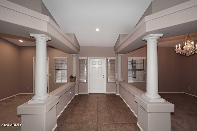 entryway with an inviting chandelier and lofted ceiling