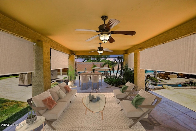 view of patio / terrace with an outdoor living space and ceiling fan