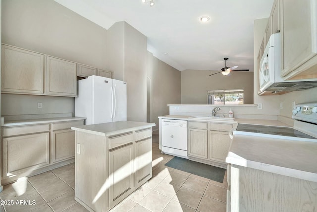 kitchen with vaulted ceiling, a kitchen island, sink, white appliances, and light tile patterned floors