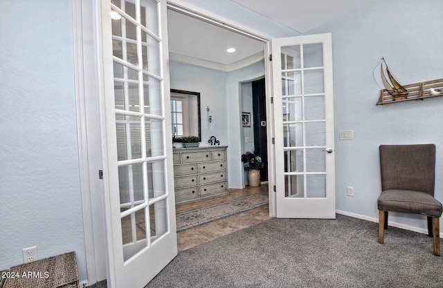 living area with french doors and carpet flooring