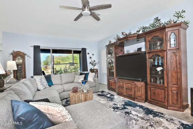 living room featuring ceiling fan and light tile patterned flooring