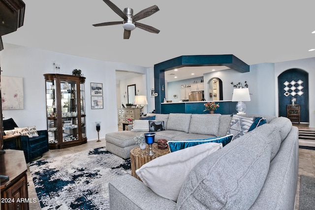 living room with light tile patterned floors and ceiling fan