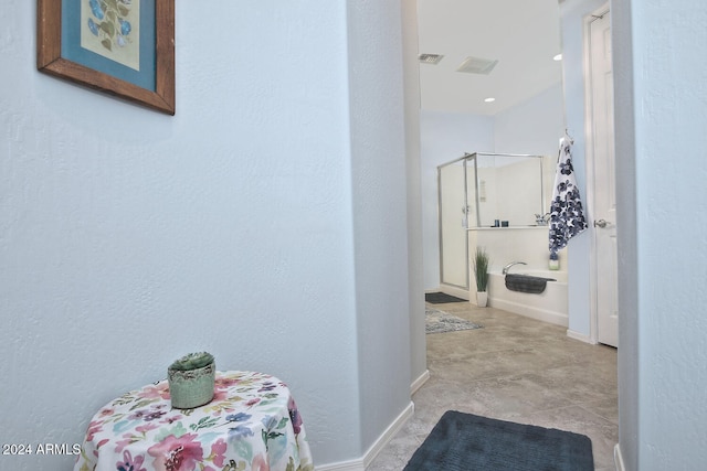 hallway featuring light tile patterned flooring