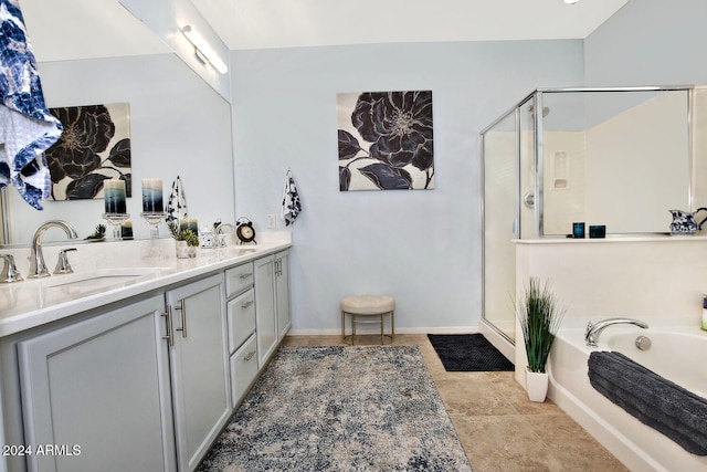 bathroom featuring separate shower and tub and vanity