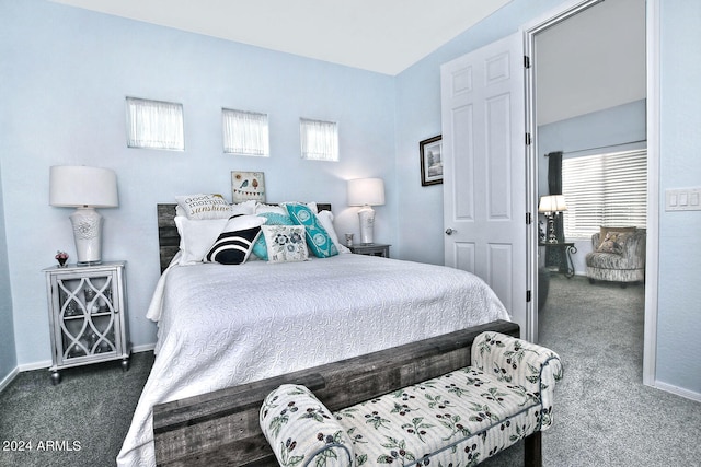 bedroom featuring dark carpet