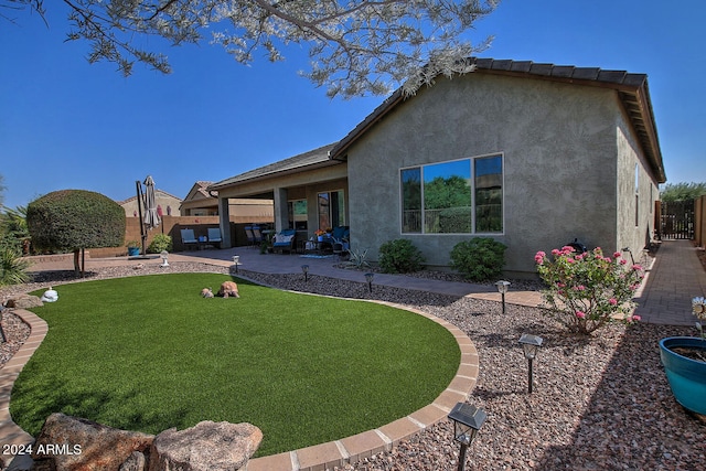 back of house with a patio area