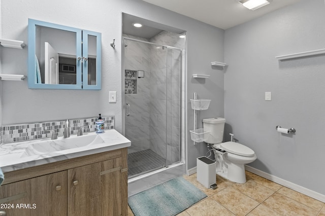 bathroom featuring tasteful backsplash, an enclosed shower, tile patterned floors, vanity, and toilet