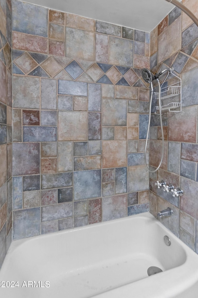 bathroom featuring  shower combination