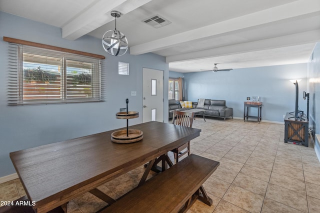 dining area featuring light tile patterned flooring, visible vents, beamed ceiling, baseboards, and a ceiling fan