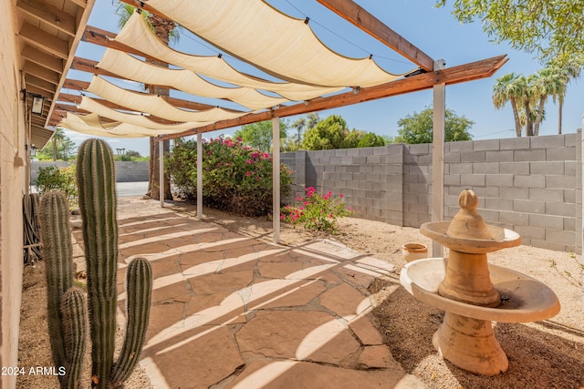 view of patio / terrace featuring a fenced backyard and a pergola