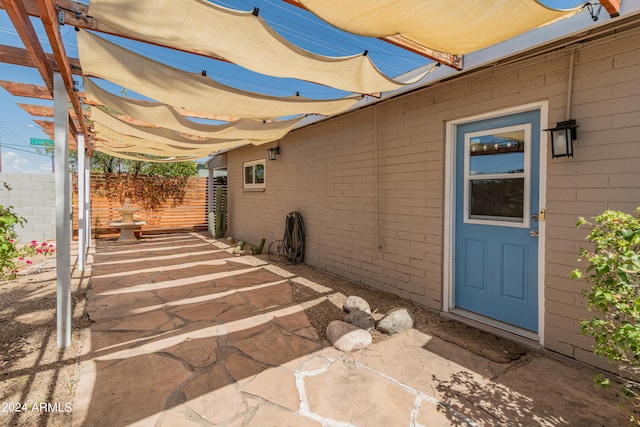 view of patio featuring fence